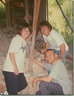Matsukawa Chiaki and Hiromi, with Matsuura Minoru, outside Hiromi's kiln