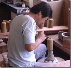 Kiln worker forming a foot