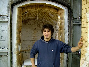 Nishida Jun in front of his kiln Nishida Jun in front of his kiln