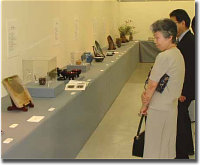 Folks Looking at Artwork at the Exhibition